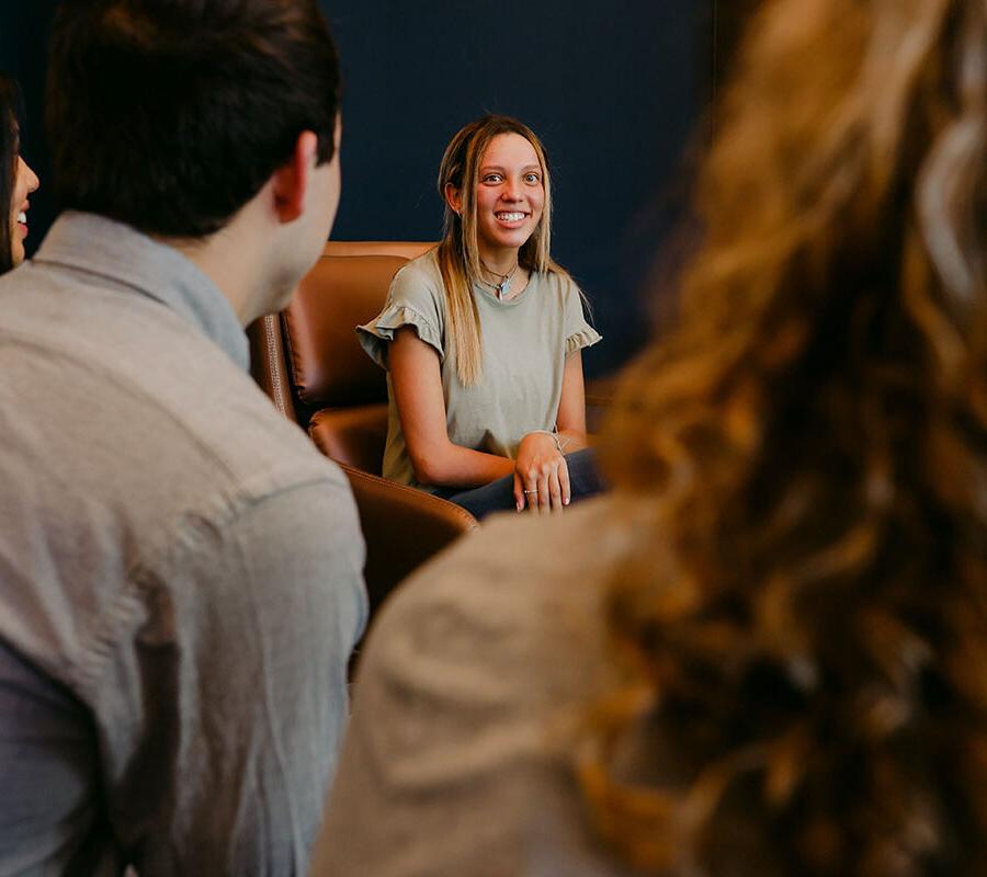 an intercultural studies major discusses with classmates